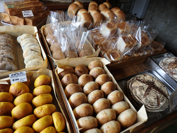 The shop’s selection before it opens. A spread of freshly baked bread.