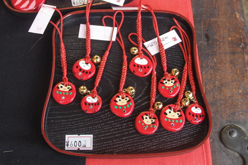 All decorations are hand-painted. Each daruma has a unique face.